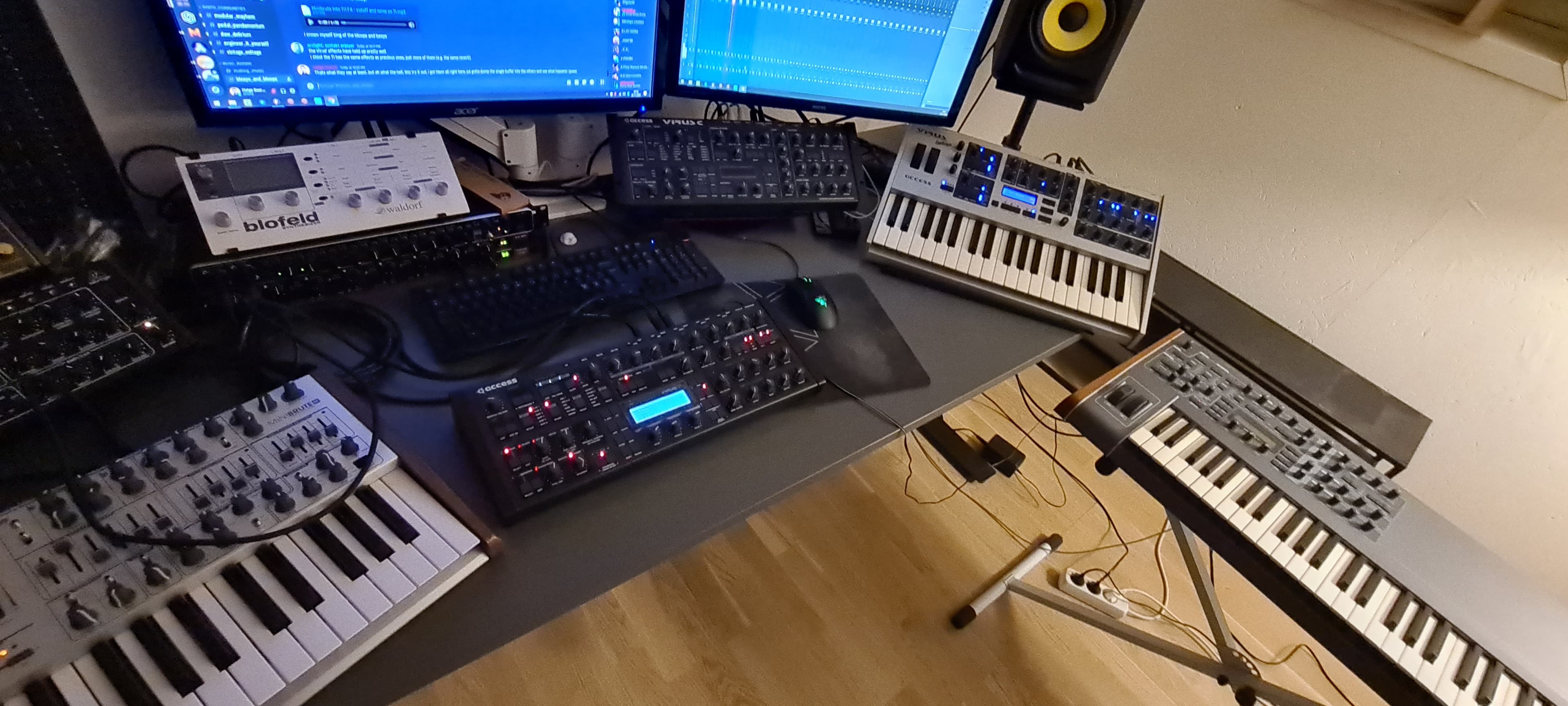 Studio overview — synths, monitors, and controlled chaos
